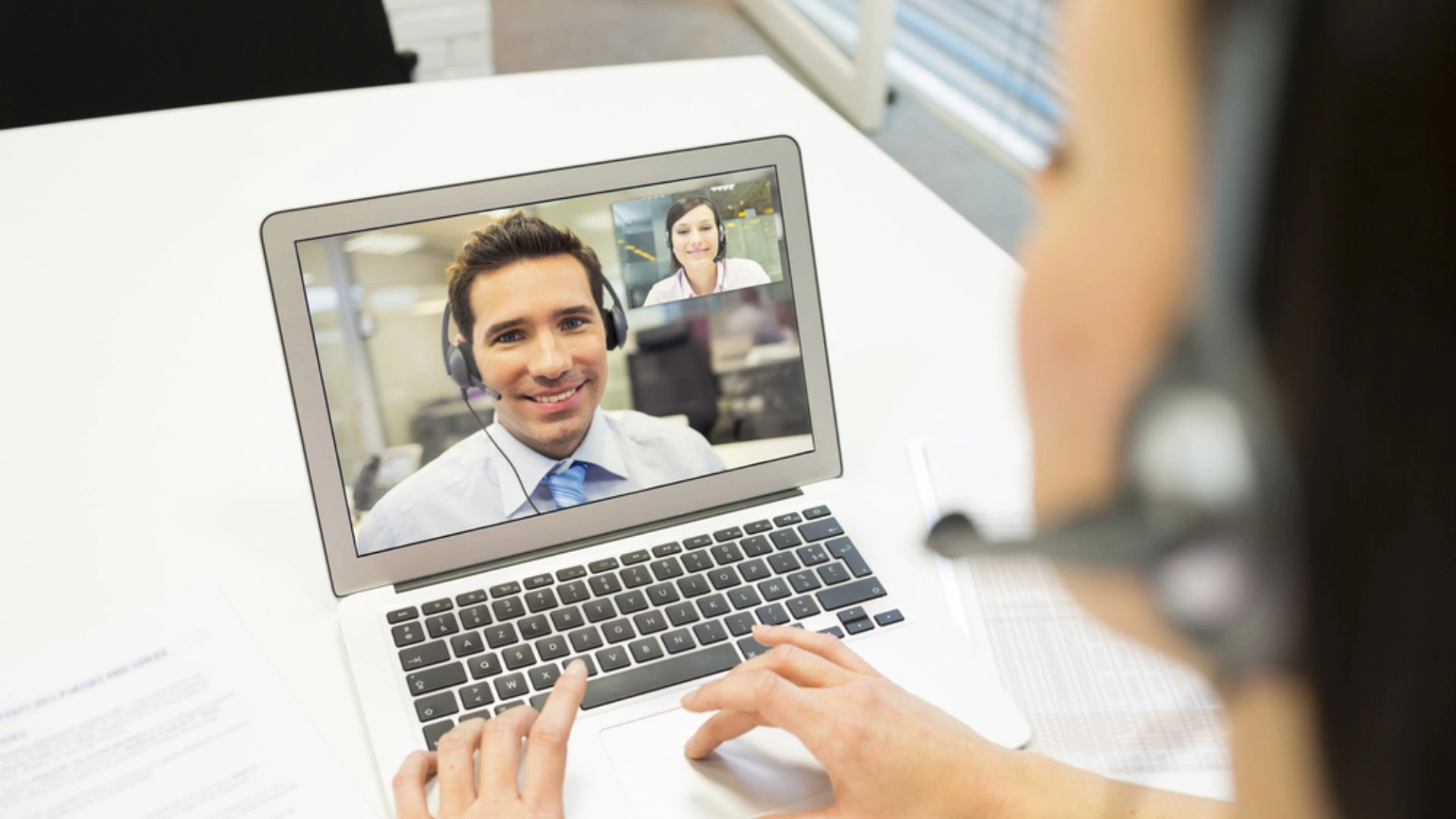 Person talking to colleague over video call