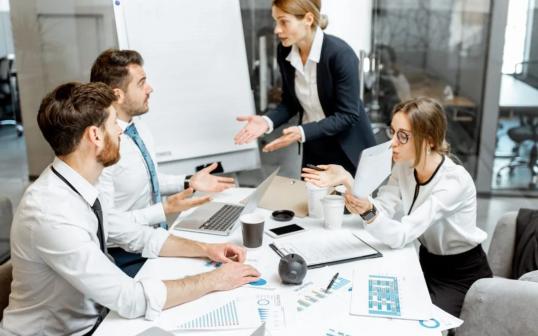 Team having a disagreement around a table