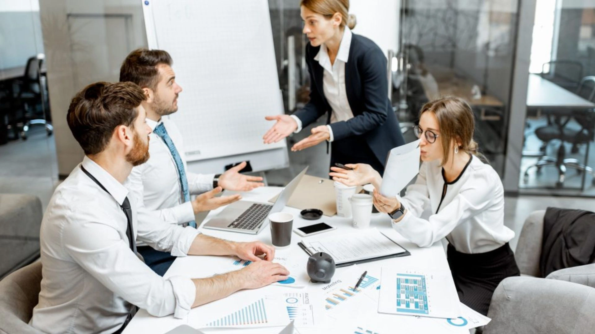 Team having a disagreement around a table
