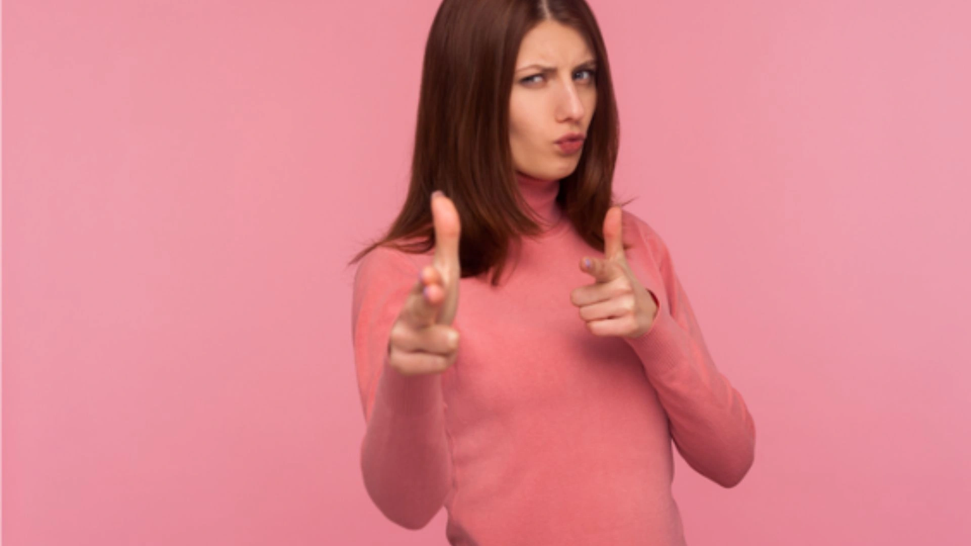 Woman shooting finger guns