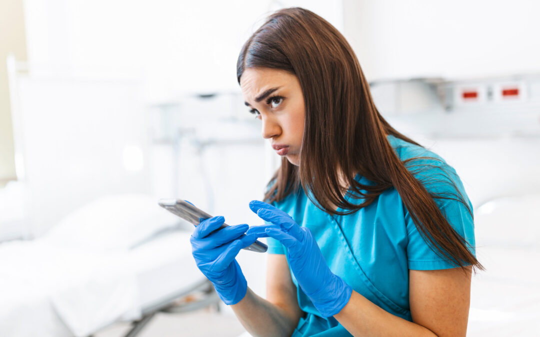 Nurse looking tired, making a phone call