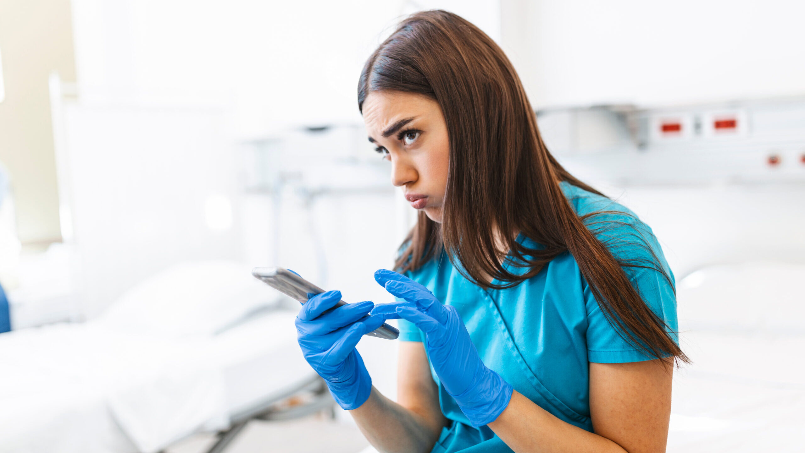 Nurse looking tired, making a phone call