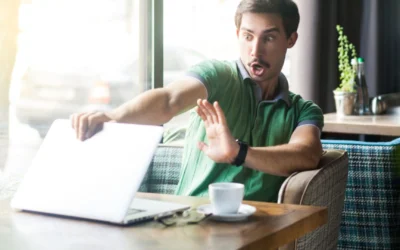 Person closing laptop in horror