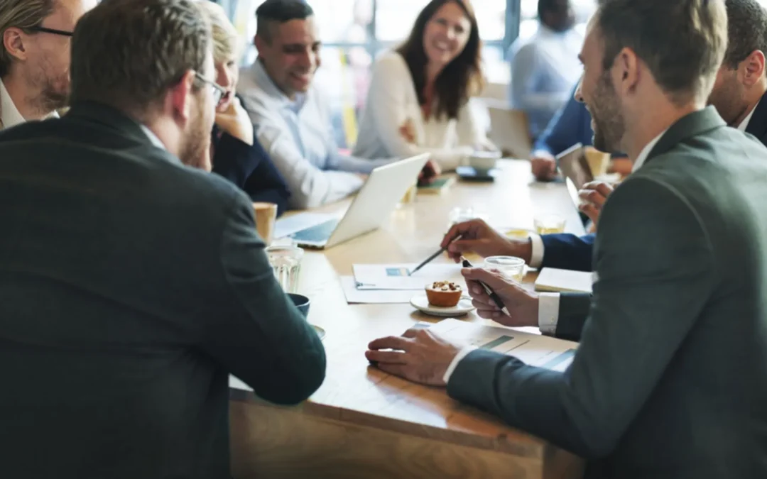 Team of people around a meeting table