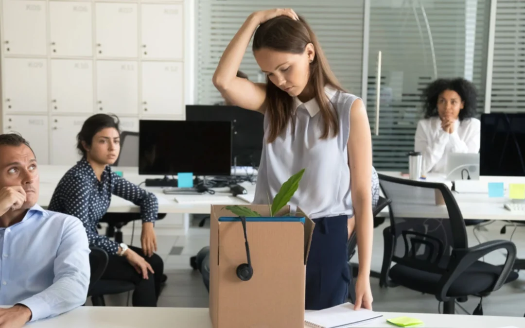Woman packing box to quit