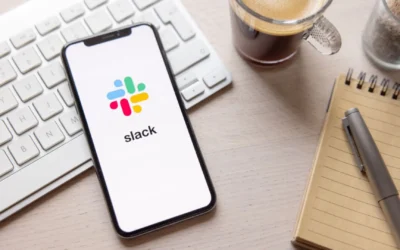 Phone showing the Slack app sitting on top of keyboard