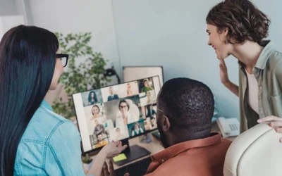 Three teammates together talking with multiple teammates on a video call