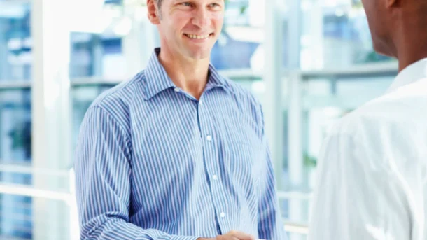 Two coworkers shaking hands