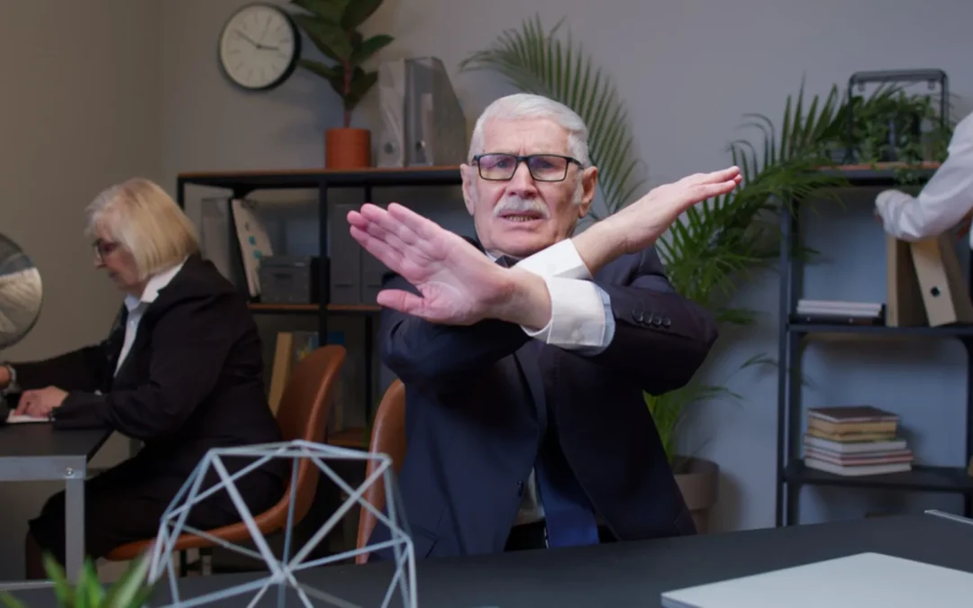 Man holding up arms in a cross