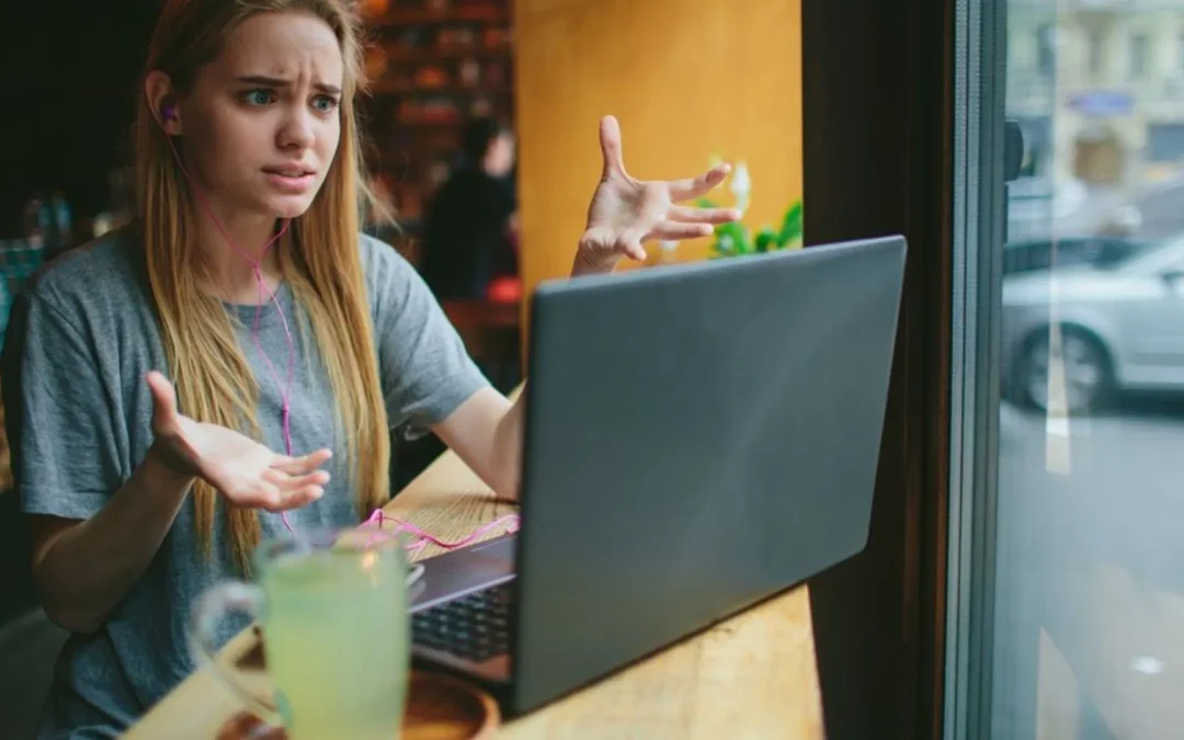 Woman on a zoom call looking frustrated