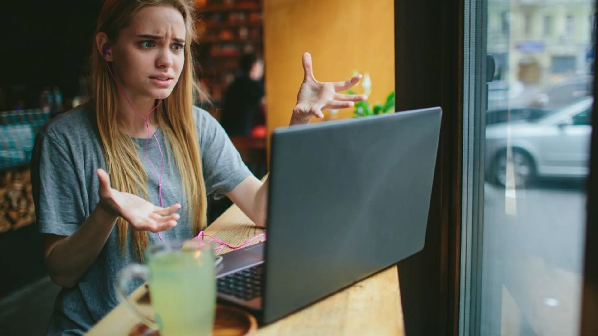 Woman on a zoom call looking frustrated