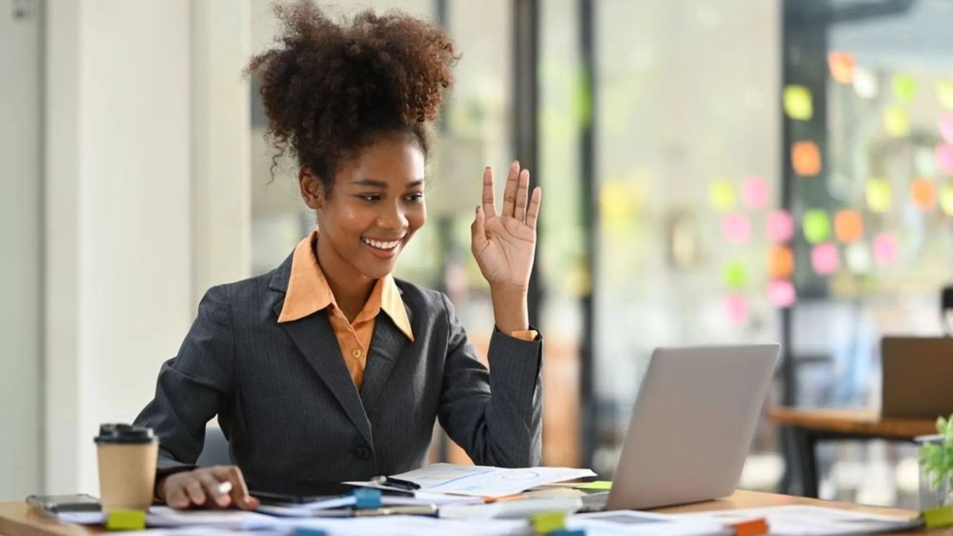 Woman raising her hand enthusiastically