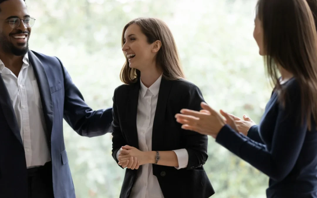 Team clapping for a colleague