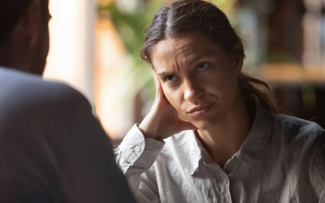 Woman in conversation looking upset