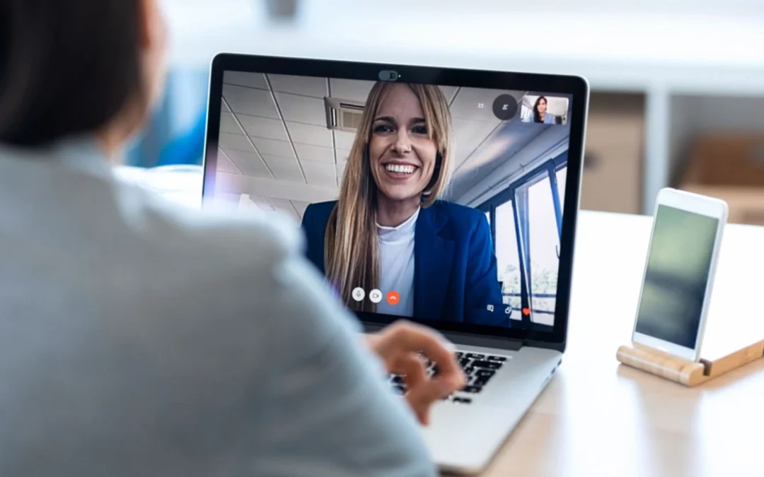 Two colleagues talking over a video call