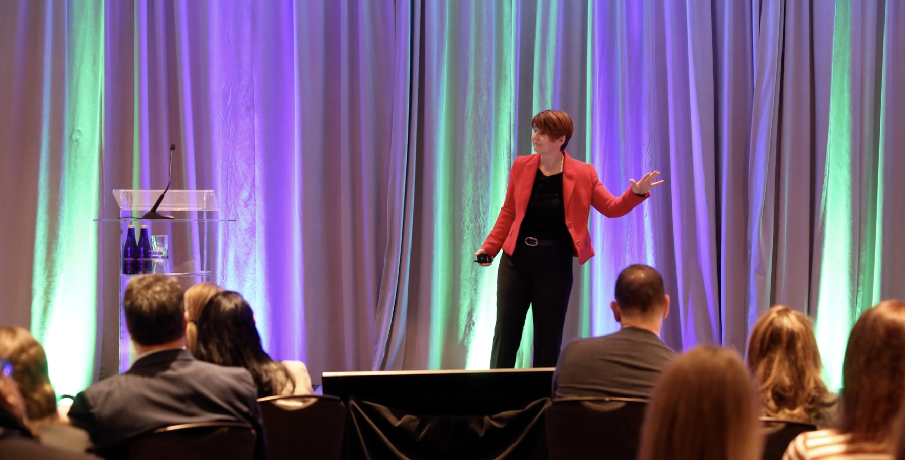 Liane Davey speaking in front of the OAPC Spring Symposium